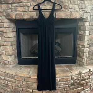 Black v-neck maxi dress with braided straps and detail. Size Medium.